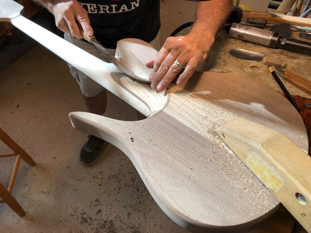 Vinny Fodera carving the bass body