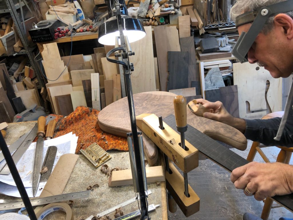 Vinny Fodera sanding the bass